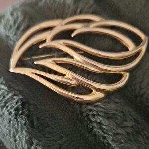 Sleek Gold Wave Brooch
